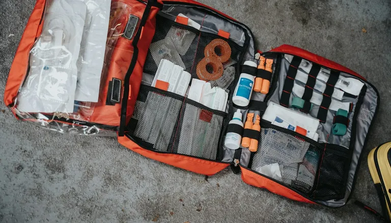 An opened emergency backpack packed with first-aid supplies
