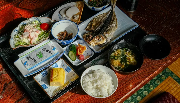 A Japanese set meal with grilled fish, rice, miso soup and small side dishes