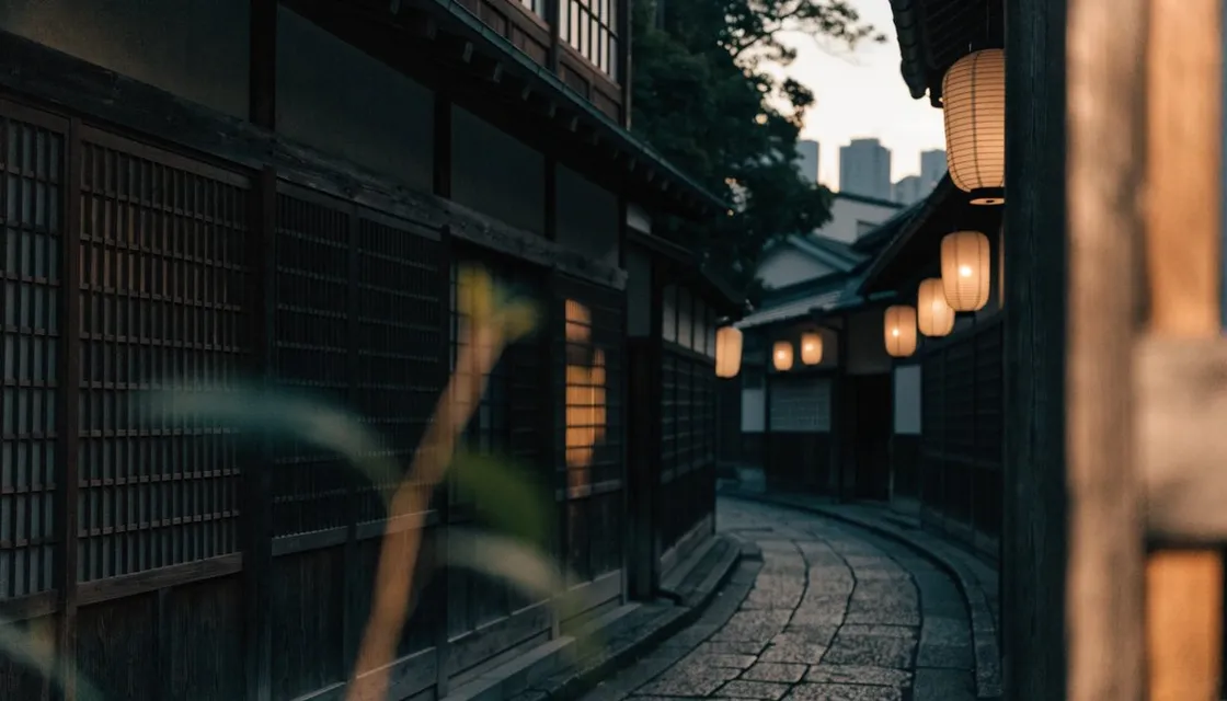 A narrow stone-paved lane in Kagurazaka lined with dark wooden lattices and glowing lanterns at dusk